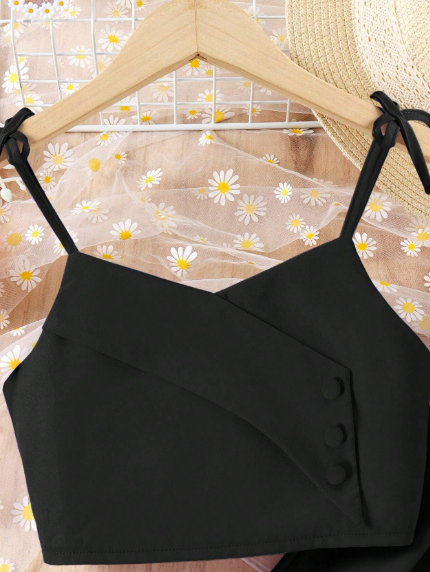 Conjunto de niña preadolescente con parte superior de tirantes y botones de unicolor y pantalón de pierna ancha