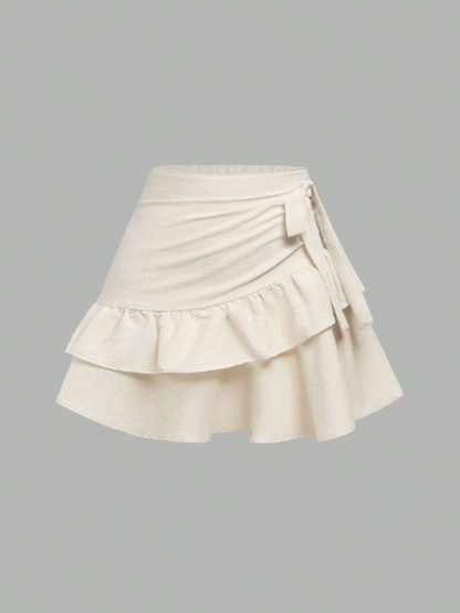 Minifalda casual y versátil para adolescentes con volantes en el bajo, lazo decorativo y unicolor
