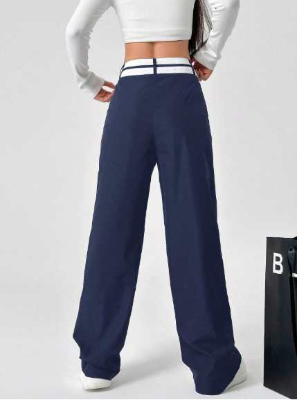 Pantalón recto para mujer con cintura asimétrica y bolsillos