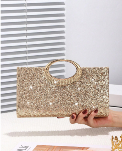 Cartera de Mano Dorada con Brillos y Asa Metálica Circular